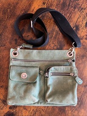 Roots Sage Green Leather Crossbody Bag with Black Strap